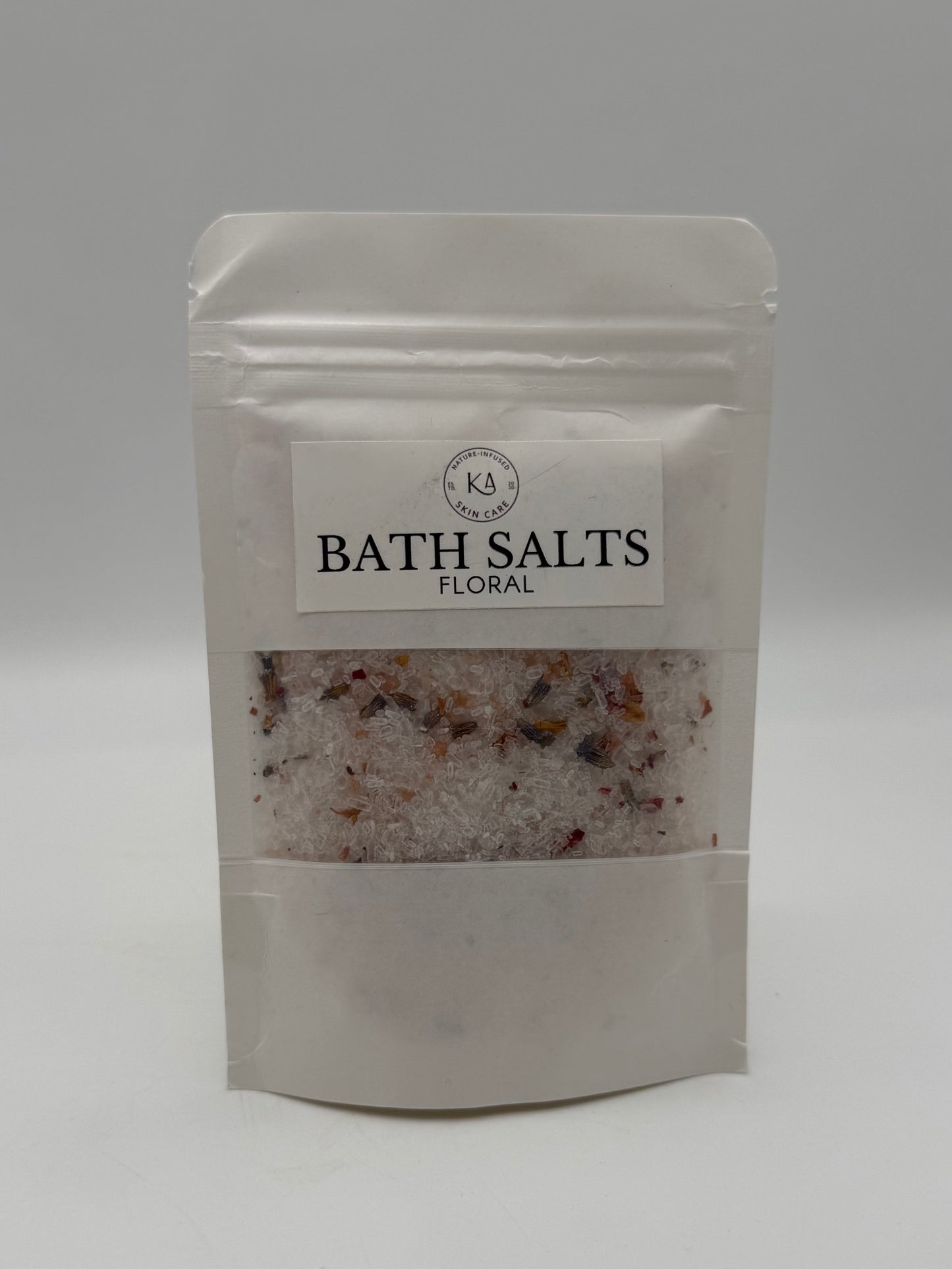 Packaged bath salts with a visible brand label on a white background