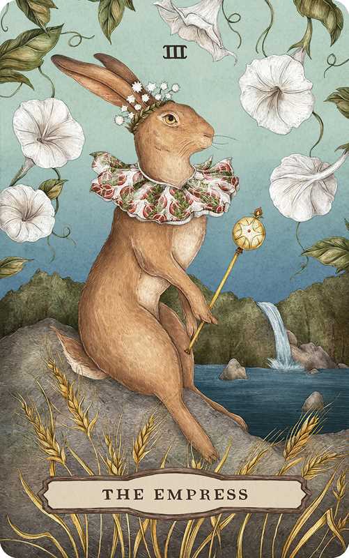 Card featuring a rabbit with floral crown and staff, set against a nature-themed background.